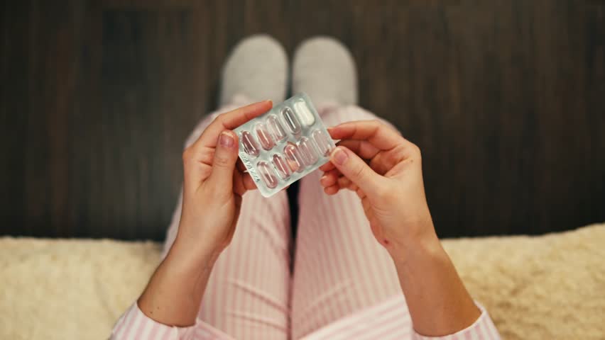 Pills and vitamins macro, Close up view of womans hands holding plenty of different drugs. Painkillers and antibiotics. Healthcare and medicine concept
