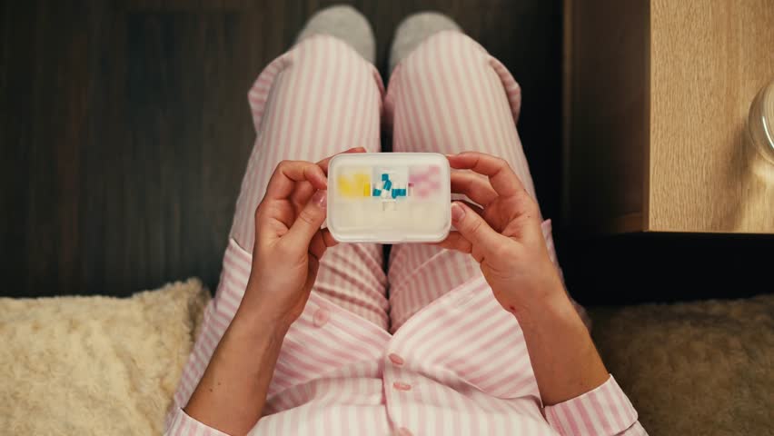 Pills and vitamins macro, Close up view of womans hands holding plenty of different drugs. Painkillers and antibiotics. Healthcare and medicine concept