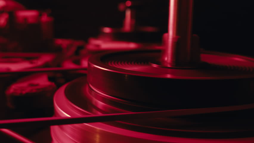 Tape audio music player, VHS studio magnetic tape, vintage retro spool reel to reel player and recorder, magnetic tape data storage close up, music studio. 