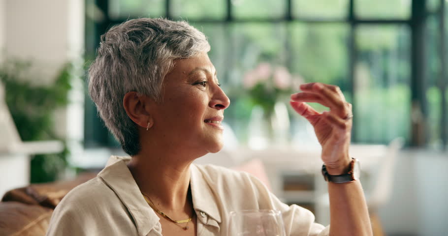 Senior woman, pills and drink water at house for supplements, prescription and chronic illness. Elderly person, smile or thinking with medicine tablet, daily routine and wellness benefits of recovery