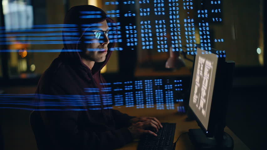 Hacker breaking computer system in data hologram closeup. Focused spy programer guy working with codes hacking security websites corporate servers in dark database center workplace alone. Cybercrime