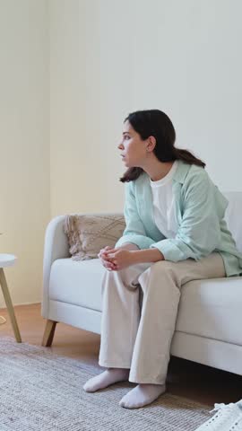 Woman suffering from anxiety attack at home