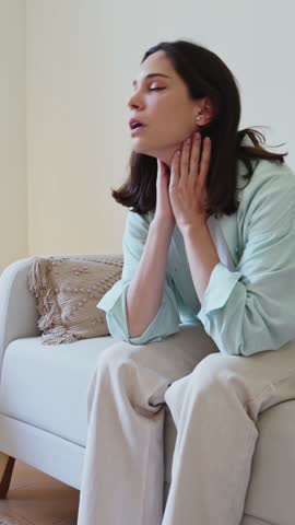 Woman suffering from anxiety attack at home