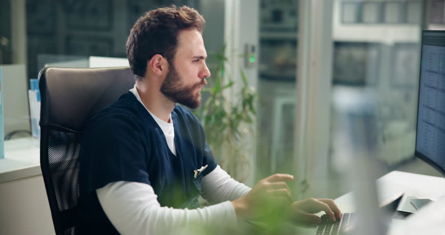 Doctor, computer and surgery notes in hospital, edit or check digital medical records with typing. Surgeon man, electronic details or info for healthcare, treatment and admin in office for update