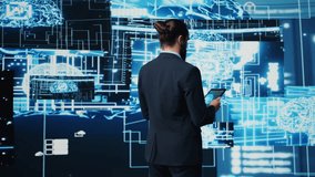 IT specialist interacting with digital AI neural networks for deep learning and algorithmic thinking, ensuring smart tech innovation and future development strategy with science. Camera B. - Powered by Shutterstock - Get 15% off with code: PIKWIZARD15