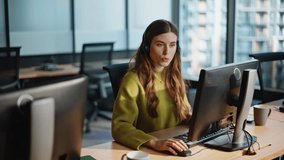 Beautiful helpful assistant consult customer in office remotely. Joyful agent speaking headset closeup. Smiling woman professional talking client in call center. Positive sales representative at work  - Powered by Shutterstock - Get 15% off with code: PIKWIZARD15