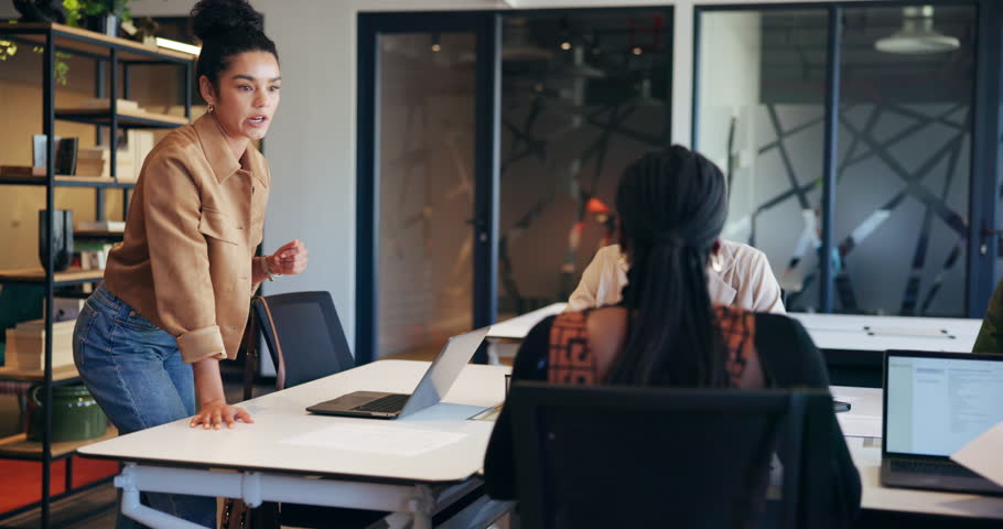Business people, laptop and meeting with presentation for planning, idea or collaboration in office. Group of creative employees, tech and discussing project with teamwork, brainstorming and startup