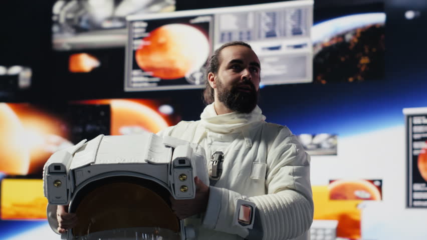 Young male cosmonaut drifting in zero gravity during a space walk, reflecting interstellar adventure, celestial wonder and the future of astronautics and planetary discovery. Space craft. Camera A.