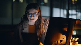 Night businesswoman trading cryptocurrency looking digital tablet at big office closeup. Smiling lady specialist working at evening home. Stock market agent reading pad computer staying late indoors  - Powered by Shutterstock - Get 15% off with code: PIKWIZARD15