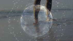 Man stepping through surf initiating tech globe overlay while carrying windsurf rig toward sea. Adventure, exploration, connectivity, innovation, outdoor, technology, resilience - Powered by Shutterstock - Get 15% off with code: PIKWIZARD15