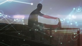 man climbing railing at sunrise stretching hamstring as network overlay expanding for fitness tech. Silhouette, motivation, connectivity, wellness, outdoor, inspiration, technology - Powered by Shutterstock - Get 15% off with code: PIKWIZARD15