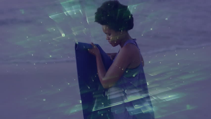 Woman adjusting strap after digital grid flickering and unrolling yoga mat on wet sand for fitness. Outdoor, wellness, serenity, mindfulness, sportswear, leisure, minimalism