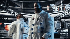 Astronaut waves hand during videocall with Earth command center while aboard spacecraft, sharing mission update. Cosmonaut salutes researchers during communication link to ground center, camera B - Powered by Shutterstock - Get 15% off with code: PIKWIZARD15