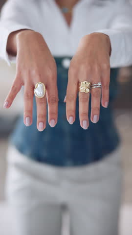 Hands, woman and fashion with designer rings for getting ready, quality check and styling tips. Female person, closeup and crafted jewellery to advertise brand, luxury accessories and statement piece