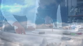 Designers unrolling plans, pointing while initiating network overlay for architecture collaboration. Professional, collaboration, digital, blueprint, architecture, teamwork, modern - Powered by Shutterstock - Get 15% off with code: PIKWIZARD15