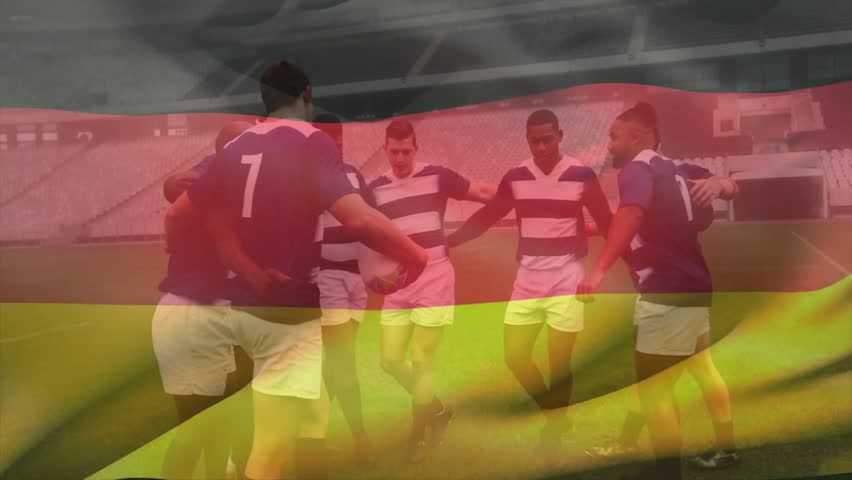 Eight rugby players entering pitch holding ball and forming huddle while exchanging rallying calls. Team, camaraderie, athletics, teamwork, sport, competition, energic