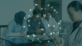 Asian doctor swiping tablet activating floating health network around medical team reviewing charts. Medical, collaboration, technology, communication, innovation, professionalism, digital - Powered by Shutterstock - Get 15% off with code: PIKWIZARD15