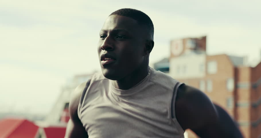 Fitness, running and black man in city for exercise, marathon training and workout outdoor. Sports, runner and person for wellness, performance and endurance for race, sprint and challenge in town