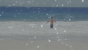 Senior man stepping into surf, wading deeper balancing as technology overlay with labels animating. Senior, beach, ocean, waves, tranquility, leisure, digital overlay - Powered by Shutterstock - Get 15% off with code: PIKWIZARD15