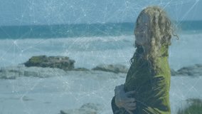 Fashion model stepping onto coast wrapping green wrap, ocean waves rolling and sunlight glinting. Coastal, nature, serenity, elegance, outdoor, leisure, bohemian - Powered by Shutterstock - Get 15% off with code: PIKWIZARD15