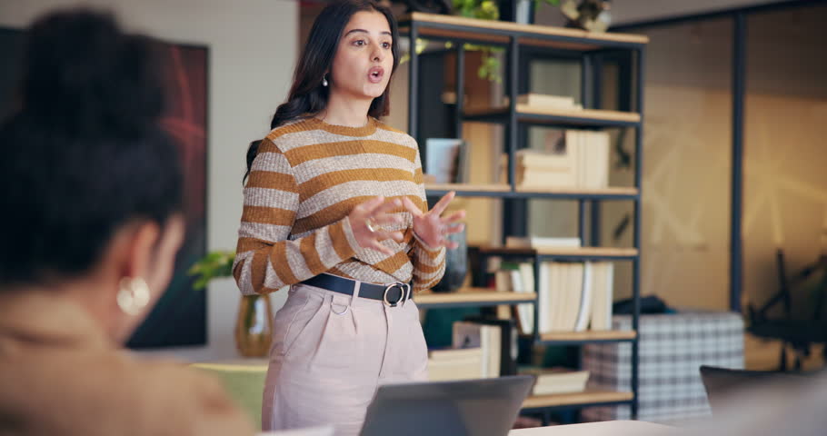 Business woman, meeting and presentation with team for creative design, project or tasks at office. Female person, speaker or discussion with group for work delegation, ideas or planning at workplace
