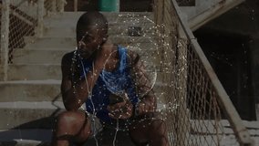 Man lifting earbud and scrolling smartphone during cooling down on fire-escape staircase in tech. Urban, lifestyle, modern, activity, relaxation, technology, fitness - Powered by Shutterstock - Get 15% off with code: PIKWIZARD15