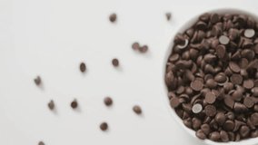 White bowl spilling coffee beans starting animated market graphs visualizing value fluctuations. Finance, data, market, trading, analytics, investment, technology - Powered by Shutterstock - Get 15% off with code: PIKWIZARD15