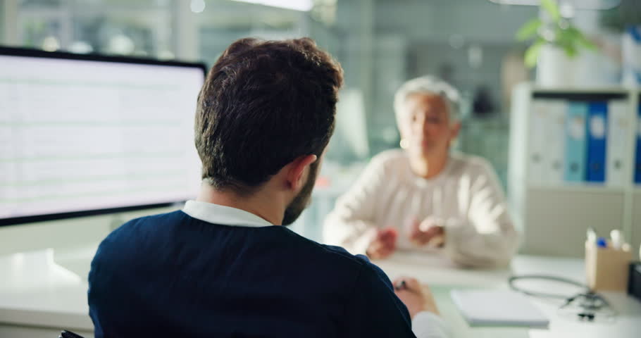 Doctor, patient and writing with prescription at hospital for medical diagnosis or symptoms. Man, healthcare worker and taking notes with senior woman for health consultation or advice at clinic