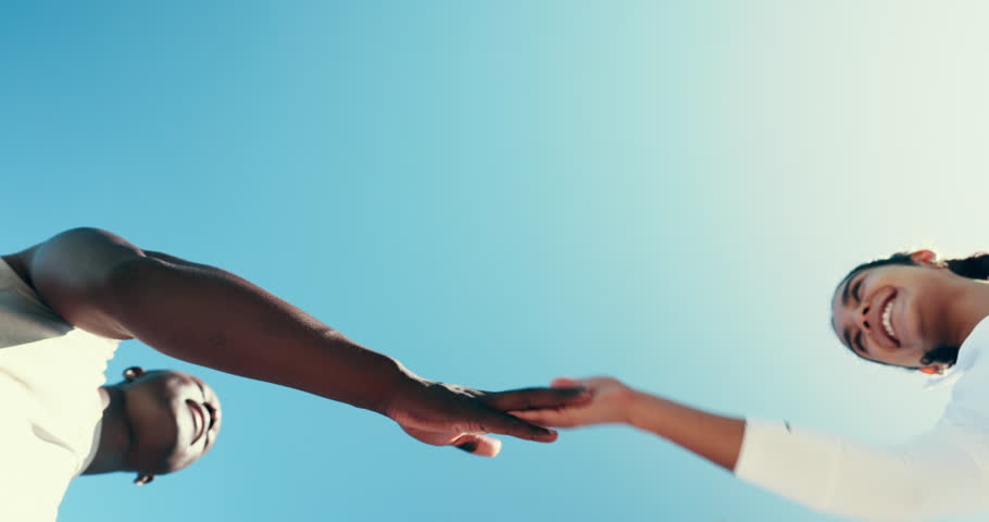 Handshake, teamwork and runner with friends and sky for support, fitness and wellness. Running club, health and solidarity with low angle of people outdoor for shaking hands, sports and training