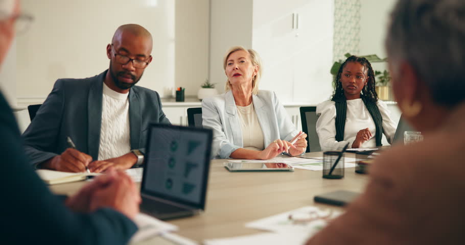 Business people, meeting and discussion with team in conference for company performance or review. Group, employees or colleagues with documents or technology for statistics or analytics at workplace