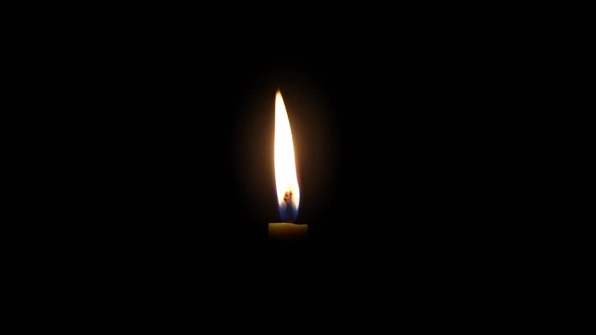 Single Candle Flame on Black Background
