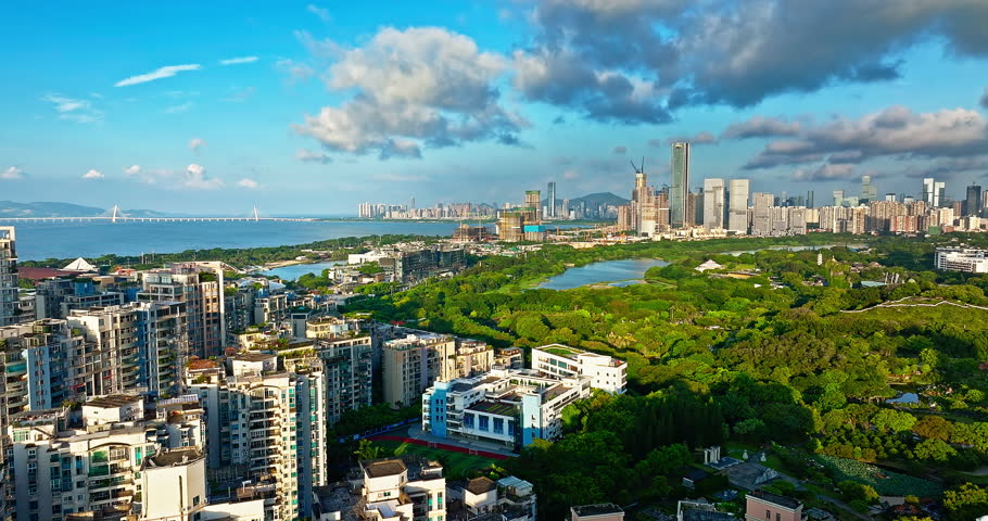 Aerial shot of city skyline and modern buildings with beautiful coastline in Shenzhen, China.