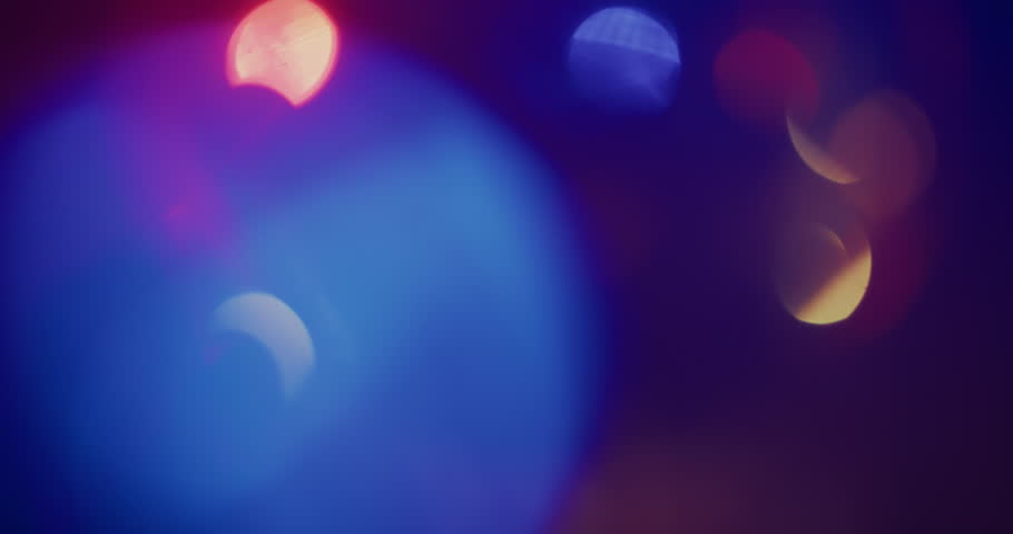 Abstract Shapes and Silhouettes Moving to the Beat Under Colorful Shifting Lights. Dynamic Cinematic Club Scene Capturing the Atmosphere of a Music Event, Motion and Modern Nightlife