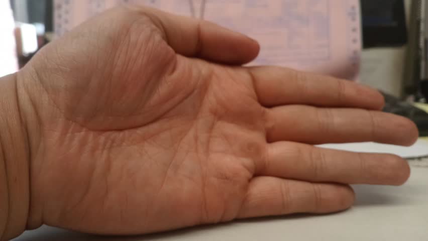 Clenched fist in stop motion, symbolizing strength, determination, and unity. Bold, powerful hand gesture captured frame by frame.

