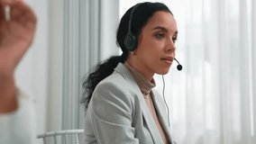 Business people wearing headset working in office to support remote customer or colleague. Call center, telemarketing, customer support agent provide service on telephone video conference call crucial - Powered by Shutterstock - Get 15% off with code: PIKWIZARD15