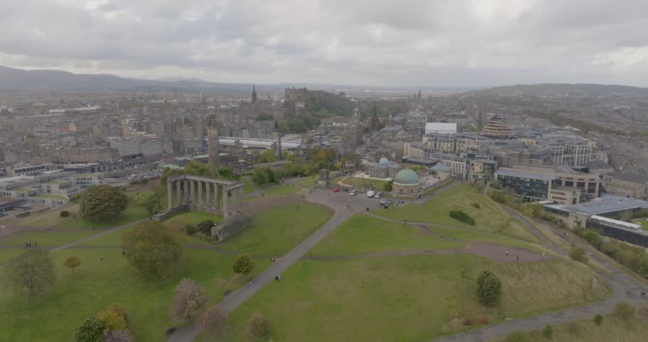 Aerial view of historic Calton Hill with beautiful cityscape and iconic monuments, Edinburgh, Scotland, United Kingdom.