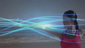 Woman lifting arms overhead activating light trails performing side fitness stretch on sandy beach. Health, wellness, exercise, vitality, movement, serenity, outdoor - Powered by Shutterstock - Get 15% off with code: PIKWIZARD15