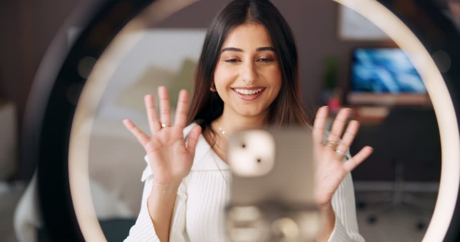 Home, vlogger and woman with ring light, social media and talking to fans on web and live streaming. Online, influencer and person with tech for tips, broadcast and advice for subscribers in bedroom
