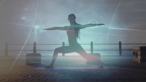 Woman stepping onto purple mat, flowing into warrior II for yoga practice, showing holographic HUD. Meditation, wellness, serenity, digital, futuristic, outdoor, empowerment - Powered by Shutterstock - Get 15% off with code: PIKWIZARD15