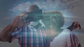 Tapping smartphone screen, mature couple capturing beach selfie with animated technology overlays. Romantic, outdoor, vibrant, leisure, digital, connection, lifestyle - Powered by Shutterstock - Get 15% off with code: PIKWIZARD15