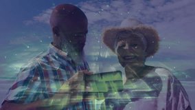 Senior couple standing shoreline exploring smartphone tech swiping framing selfie and capturing pic. Senior, companionship, technology, leisure, vacation, harmony, lifestyle - Powered by Shutterstock - Get 15% off with code: PIKWIZARD15