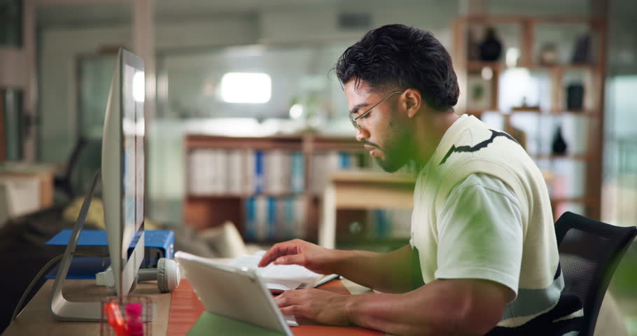 University student, tablet and research on computer in library with confusion, doubt or elearning. Education, man and typing on technology at college for essay solution, thesis and online assessment