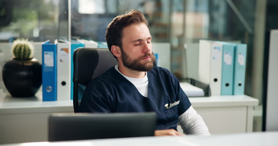 Tired nurse, yawn or man in hospital with burnout, low energy or fatigue in healthcare. Bored, exhausted or overworked doctor in clinic office with stress, lazy worker and sleepy medical employee
