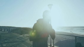 Teal glitch sweeping pier initiating FIGHT fitness overlay with hoodie boxer throwing cross punches. Action, athletics, strength, resilience, sportswear, outdoor, dynamic - Powered by Shutterstock - Get 15% off with code: PIKWIZARD15