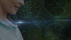 Mature woman bringing tablet, tapping screen in studio, pulsing blue gear animations tech demo. Technology, innovation, digital, futuristic, ui, interface, professional - Powered by Shutterstock - Get 15% off with code: PIKWIZARD15