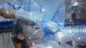 Female dentist leaning over patient activating swirling network overlay for examining teeth. Dentistry, healthcare, oral health, medical technology, digital interface, clinical, examination - Powered by Shutterstock - Get 15% off with code: PIKWIZARD15