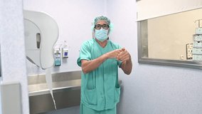 Surgeon scrubbing hands before surgery in OR - Powered by Shutterstock - Get 15% off with code: PIKWIZARD15