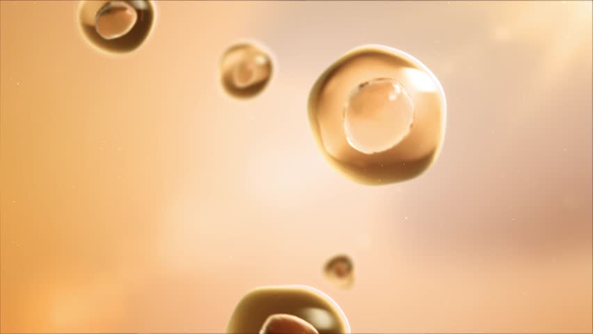 Stem cell division under microscope. Human cell division or cloning. Cloning close-up. Mitosis in progress. Cosmetic cells, yellow background, 3D animation, 4k.