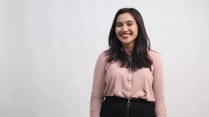 young woman looking to her right with an open mouth and a surprised or excited expression. Her gaze is directed off-camera, as if reacting to something unseen.