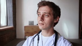 Professional man in lab coat holds tablet with both hands, scrolling through information attentively, fully engaged in medical review. Concept of modern medicine, digital records, smart care. - Powered by Shutterstock - Get 15% off with code: PIKWIZARD15